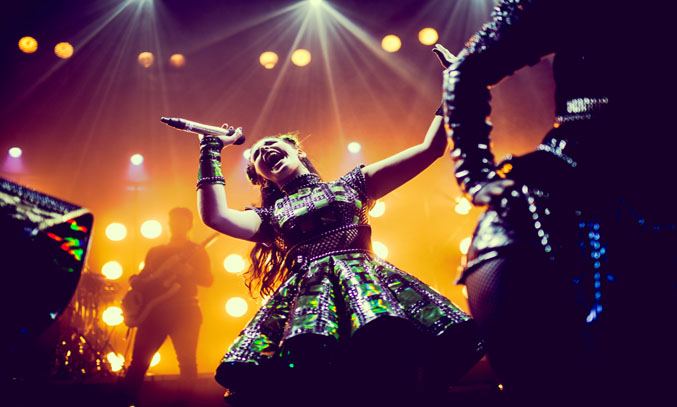 Millie O'Connell as Anne Boleyn in SIX. Photo Credit: Idil Sukan/Draw HQ